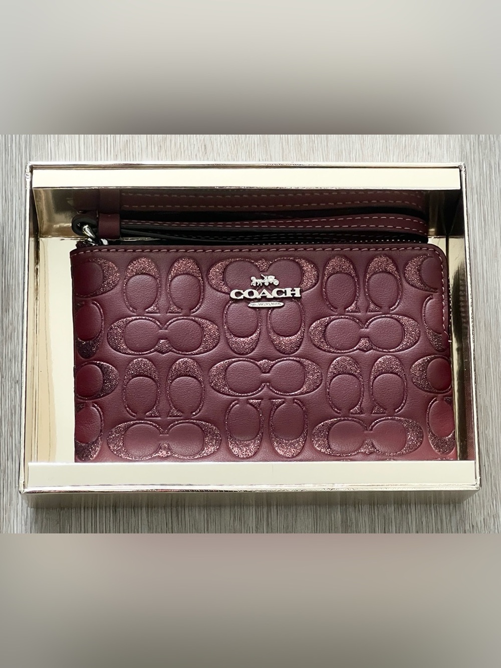 Coach Plum Embossed Signature Leather Clutch